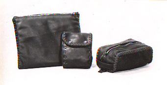 leather accessories including portfolios, belt pouches, shaving kits handmade with braided leather seams
